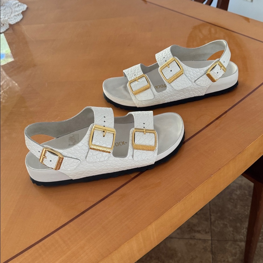 Birkenstock Women's White Sandals with Gold Accents size 39